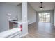 Open-concept space with hard floors, bar sink area, and sliding glass doors to a patio at 325 Berry Ct, Villa Rica, GA 30180