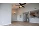 Open concept living room with high ceilings, wood floors, and an adjacent kitchen at 325 Berry Ct, Villa Rica, GA 30180