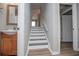 Bright stairway with wood-look flooring, crisp white trim, and gray accents at 325 Berry Ct, Villa Rica, GA 30180