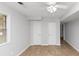 Bedroom with tile flooring, windows for natural light, and closet doors at 3900 Bressler Cir, Decatur, GA 30035