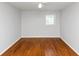 An empty bedroom with a ceiling fan and hardwood floors gives a great blank slate at 3900 Bressler Cir, Decatur, GA 30035