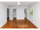 Bedroom featuring hardwood floors, neutral walls, walk-in closet, and bathroom at 3900 Bressler Cir, Decatur, GA 30035