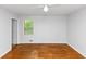 Spacious bedroom with hardwood floors, and large window providing ample natural light at 3900 Bressler Cir, Decatur, GA 30035
