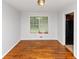 Inviting dining area with hardwood floors and a large window for natural light at 3900 Bressler Cir, Decatur, GA 30035