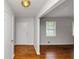 Inviting entryway showcasing a front door, neutral walls, and hardwood floors at 3900 Bressler Cir, Decatur, GA 30035