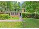 Charming home with brick facade, manicured landscaping, and a covered carport at 3900 Bressler Cir, Decatur, GA 30035