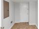 Hallway with tile flooring and a white door, showing an electrical panel on the wall at 3900 Bressler Cir, Decatur, GA 30035