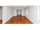Spacious living room featuring hardwood floors, neutral walls, and a large window at 3900 Bressler Cir, Decatur, GA 30035