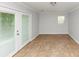 Sunroom featuring tile flooring and french doors to let in natural light at 3900 Bressler Cir, Decatur, GA 30035