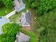 Aerial view of roof and backyard with surrounding foliage at 4325 Camellia Ridge Sw Way, Lilburn, GA 30047