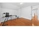 Bedroom features hardwood floors, natural light, and neutral paint at 4325 Camellia Ridge Sw Way, Lilburn, GA 30047