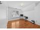 Bedroom features hardwood floors, natural light, and neutral paint at 4325 Camellia Ridge Sw Way, Lilburn, GA 30047