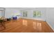 Large bonus room area with hardwood floors and natural light at 4325 Camellia Ridge Sw Way, Lilburn, GA 30047