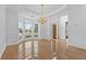 Formal dining area with chandelier, beautiful flooring, large bright windows and decorative molding at 4325 Camellia Ridge Sw Way, Lilburn, GA 30047