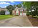 Charming two-story home with brick facade and attached two-car garage at 4325 Camellia Ridge Sw Way, Lilburn, GA 30047
