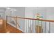 Upstairs hallway with open staircase and entry views at 4325 Camellia Ridge Sw Way, Lilburn, GA 30047