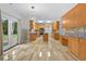 Well-lit modern kitchen featuring stainless appliances, center island, and lots of cabinets at 4325 Camellia Ridge Sw Way, Lilburn, GA 30047