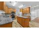 Modern kitchen featuring stainless appliances, granite countertops, and center island at 4325 Camellia Ridge Sw Way, Lilburn, GA 30047