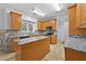 Modern kitchen with stainless steel appliances and a granite countertop center island at 4325 Camellia Ridge Sw Way, Lilburn, GA 30047