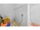 Cozy laundry room space with wire rack shelving, utility connections and door access to other areas at 4325 Camellia Ridge Sw Way, Lilburn, GA 30047