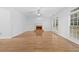 Spacious living room featuring fireplace, large windows, and light hardwood floors at 4325 Camellia Ridge Sw Way, Lilburn, GA 30047