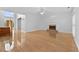 Bright living room features hardwood floors, fireplace, and large windows for natural light at 4325 Camellia Ridge Sw Way, Lilburn, GA 30047