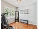 Bedroom space with exercise machine, bench, and view to the yard at 4915 Bayberry Dr, Cumming, GA 30040