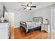 Bedroom with hardwood floors, neutral walls, and tv at 4915 Bayberry Dr, Cumming, GA 30040