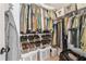 Organized closet with clothing racks, shelves, and storage bins at 4915 Bayberry Dr, Cumming, GA 30040