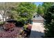 Aerial view of a home with a two-car garage and a well-maintained front yard and driveway at 4915 Bayberry Dr, Cumming, GA 30040
