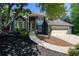 Charming blue two-story home with manicured front yard and inviting walkway at 4915 Bayberry Dr, Cumming, GA 30040