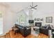 Bright living room with vaulted ceiling, fireplace and large windows at 4915 Bayberry Dr, Cumming, GA 30040