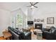 Bright living room with vaulted ceiling, fireplace and large windows at 4915 Bayberry Dr, Cumming, GA 30040