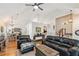 Open-concept living room featuring hardwood floors and a vaulted ceiling at 4915 Bayberry Dr, Cumming, GA 30040