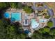 Aerial view of community pool and recreational area with multiple pools, slides, and lounging areas at 5065 Harbour Ridge Dr, Alpharetta, GA 30005