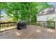 Spacious outdoor deck area with wooden railings, outdoor furniture, and backyard views at 5065 Harbour Ridge Dr, Alpharetta, GA 30005