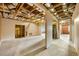 Spacious unfinished basement with exposed ceiling and support beams, offering potential for future living space at 5065 Harbour Ridge Dr, Alpharetta, GA 30005