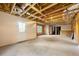 Unfinished basement with walkout door and exposed ceiling, ready for customization and personalization at 5065 Harbour Ridge Dr, Alpharetta, GA 30005