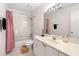 Bathroom with tub/shower combination, vanity sink, and decorative pink shower curtain at 5065 Harbour Ridge Dr, Alpharetta, GA 30005
