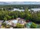 Aerial view of community pool with water slides, lounge seating and lake views at 5065 Harbour Ridge Dr, Alpharetta, GA 30005