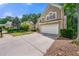 Home with well-kept lawn, driveway and 2-car garage in a suburban neighborhood at 5065 Harbour Ridge Dr, Alpharetta, GA 30005