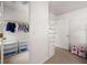 Walk-in closet with shelving and hanging rods to organize clothing and accessories, offering ample storage space at 5065 Harbour Ridge Dr, Alpharetta, GA 30005