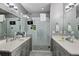 A modern bathroom with double sinks, a glass-enclosed shower and modern lighting at 743 Taylor Ne Ct, Atlanta, GA 30324