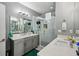 Large bathroom boasting double sinks, a glass enclosed shower and modern fixtures at 743 Taylor Ne Ct, Atlanta, GA 30324