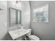 Powder room with pedestal sink, modern faucet, and window with blinds at 743 Taylor Ne Ct, Atlanta, GA 30324