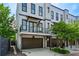 Charming three-story townhome featuring a private balcony and a convenient one-car garage at 743 Taylor Ne Ct, Atlanta, GA 30324