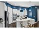 Modern kitchen featuring stainless steel appliances, a center island, and sleek white cabinetry at 743 Taylor Ne Ct, Atlanta, GA 30324