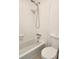 Clean bathroom featuring a white tub with shower and a matching toilet at 1502 Countryside Se Pl # 1502, Smyrna, GA 30080