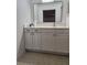 Bathroom featuring a white vanity with black hardware and a large rectangular mirror at 1502 Countryside Se Pl # 1502, Smyrna, GA 30080