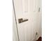 A pristine white door with modern hardware, adding a touch of style to the interior at 1502 Countryside Se Pl # 1502, Smyrna, GA 30080